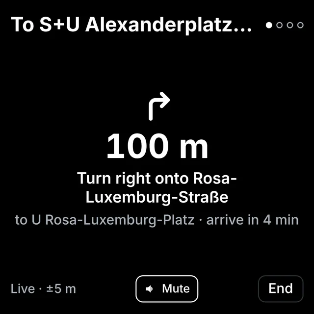 Live guidance: a right-turn arrow, 100 m, turn right onto Rosa-Luxemburg-Straße, to U Rosa-Luxemburg-Platz, arrive in 4 minutes.
